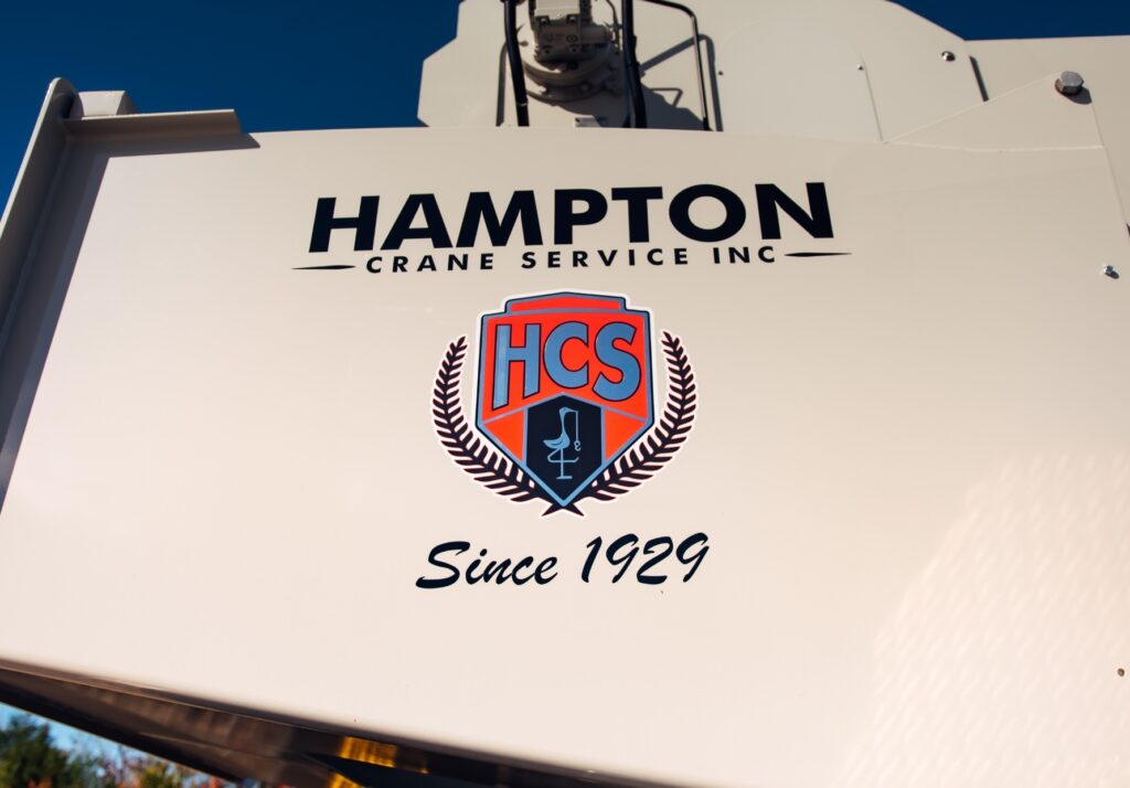 Hampton Crane Service's logo on their machine